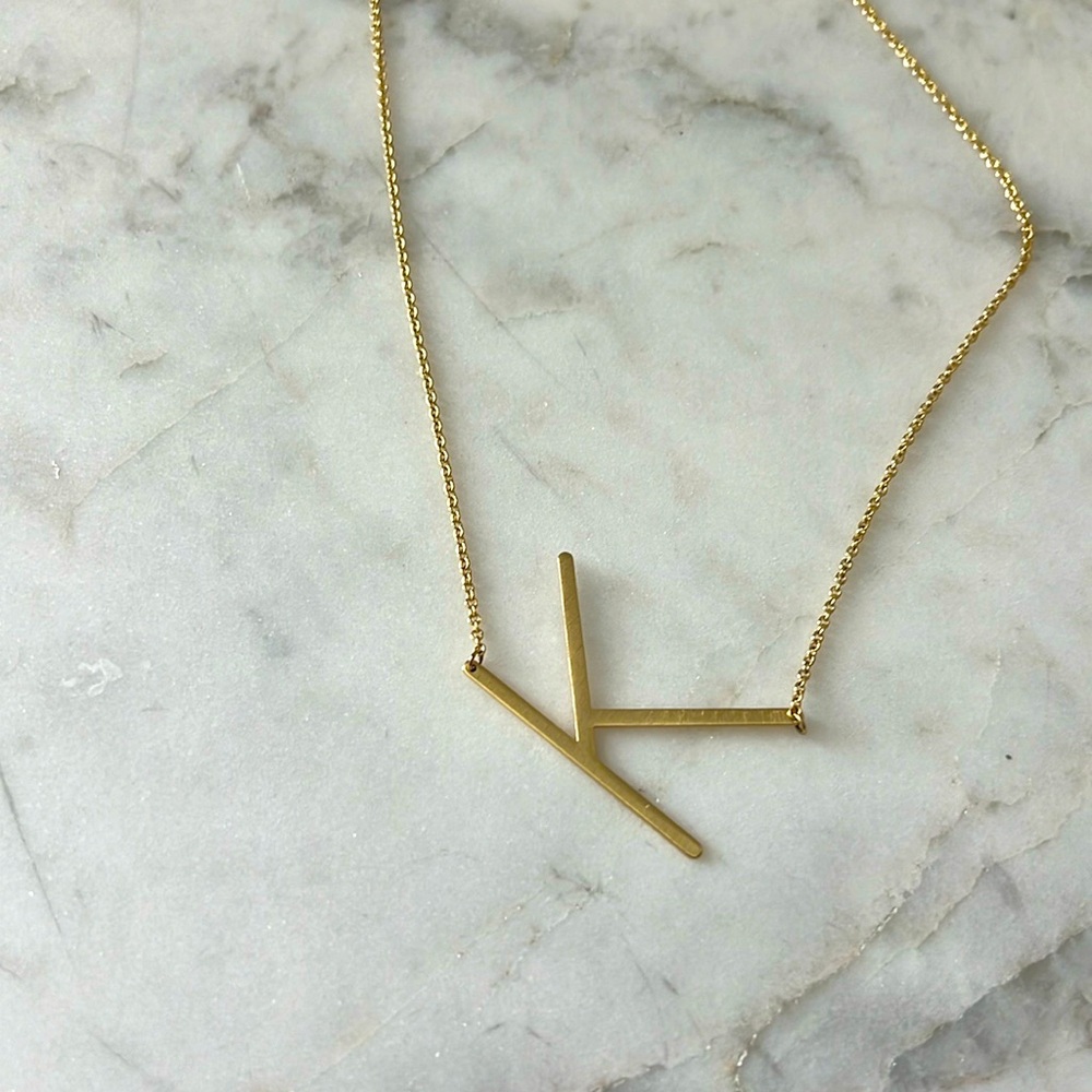 “K” necklace.